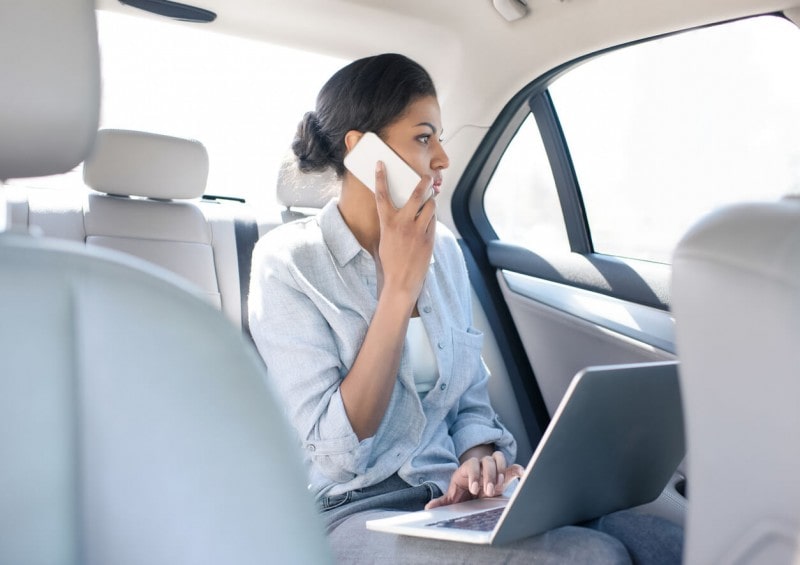 businesswoman in back of car