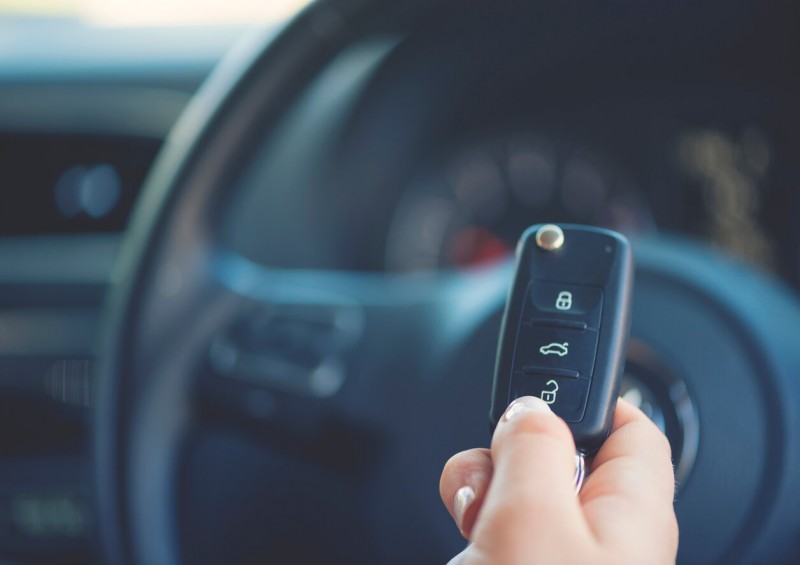 Car keys infront of steering wheel