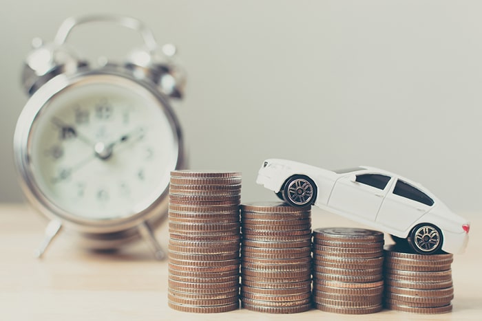 Car climbing on money