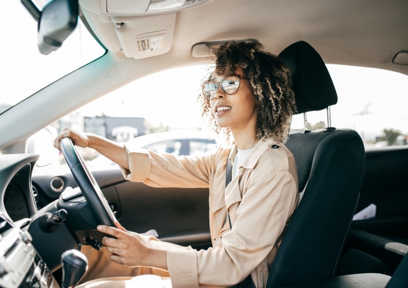 Young woman driving a car